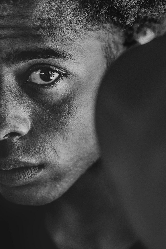 Half-face portrait of a boxer in black and white