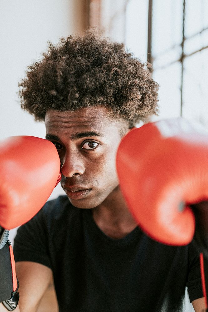 Young fighter wearing boxing gloves