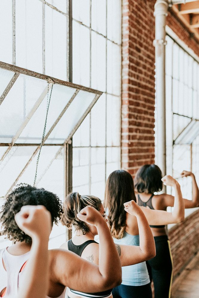 Strong sporty women in a studio