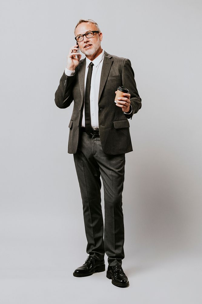 Businessman busy talking on the phone in a studio shoot