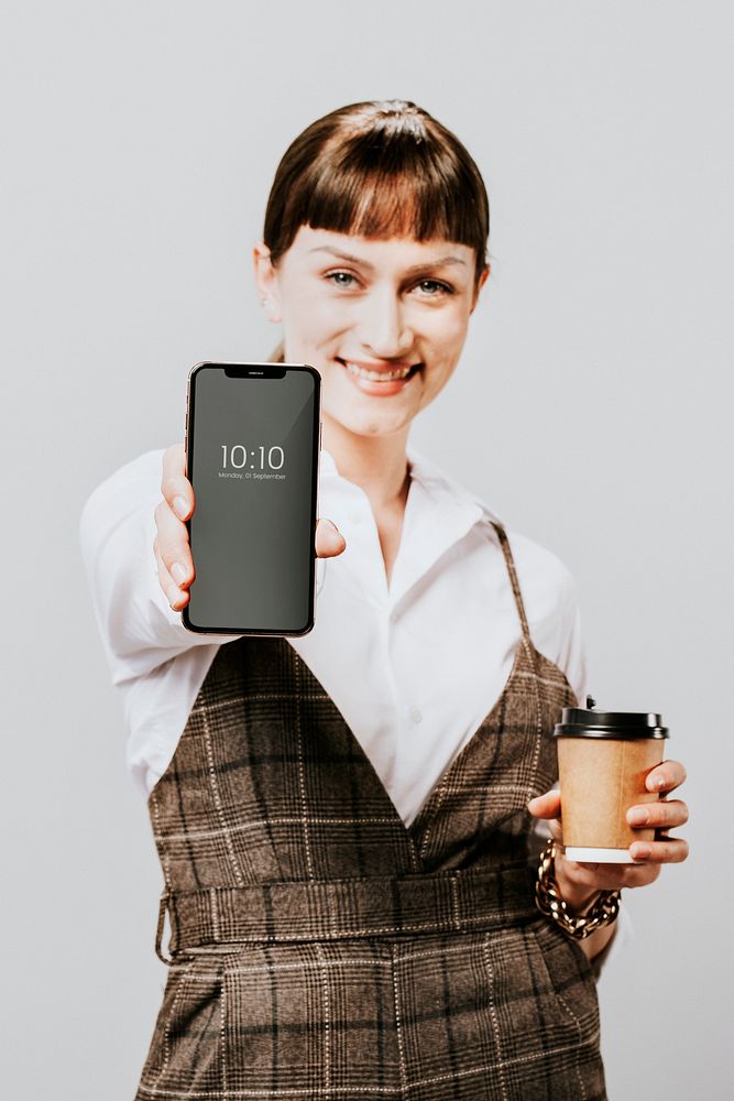 Happy woman holding a mobile phone