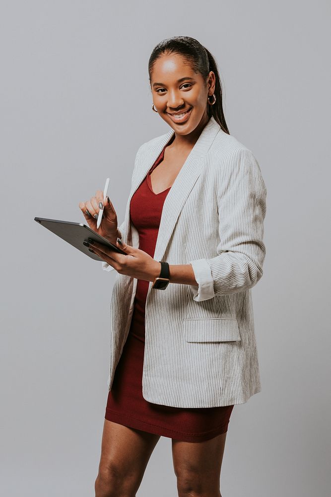Businesswoman writing on on a tablet