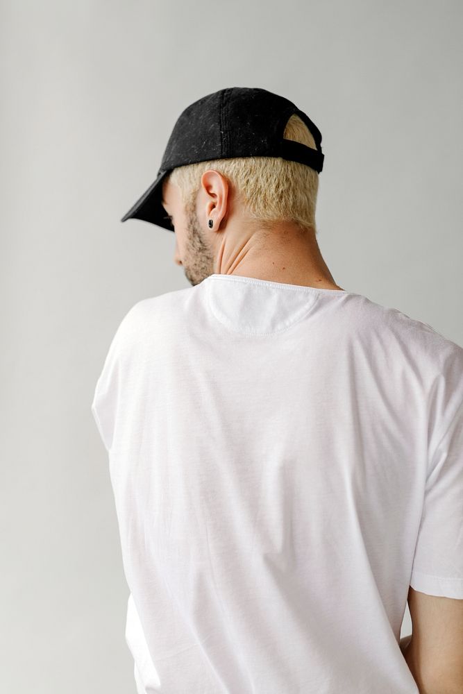 Rearview of a man in a white tee