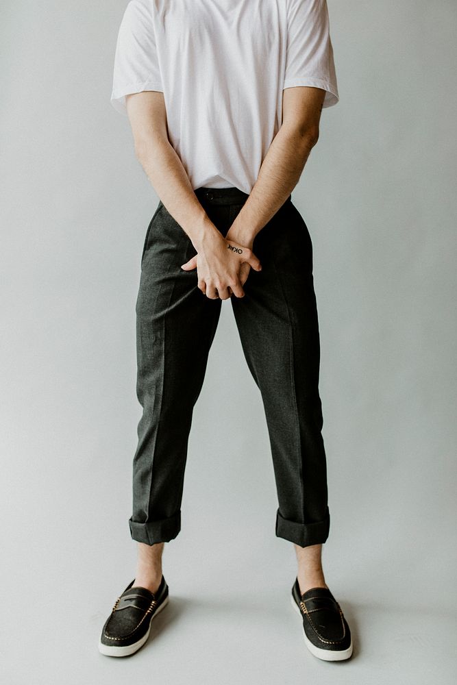 Casual man in a white t-shirt and black pants