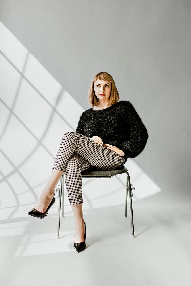 Woman in a fluffy sweater sitting