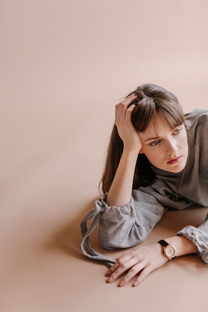 Brown hair model posing in a studio