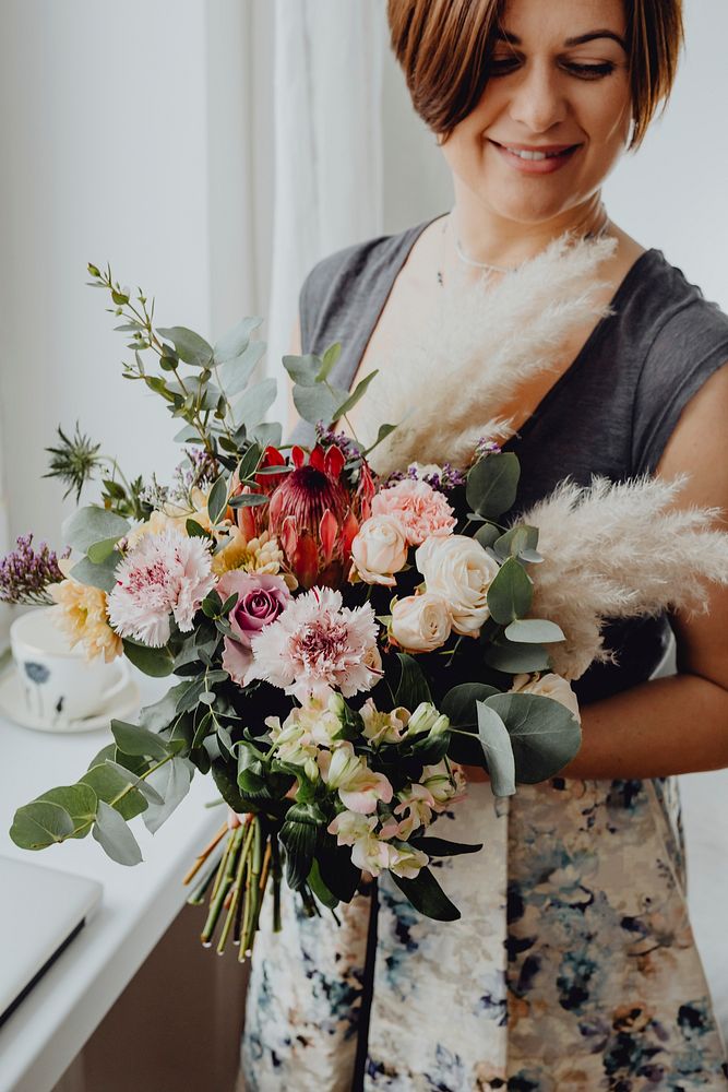 Woman holding a flower bouquet