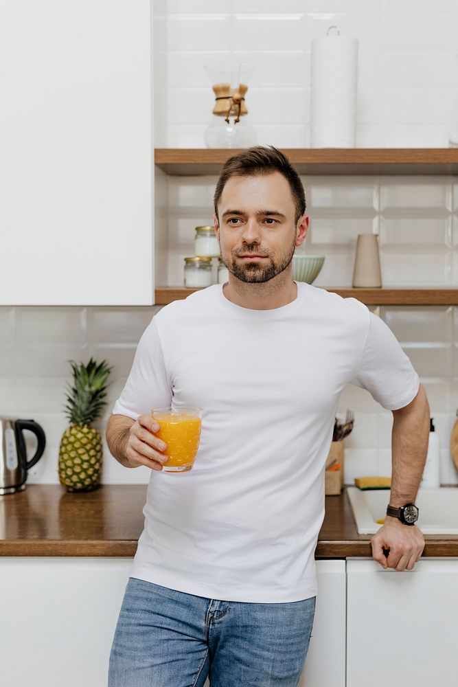 Man with an orange juice in his hand