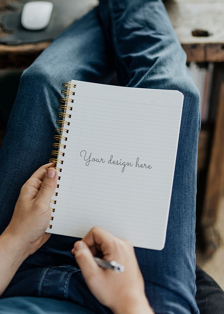 Student writing on his notebook