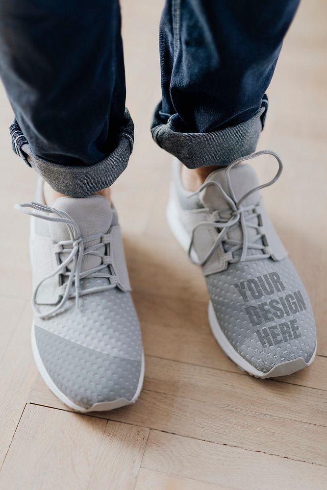 Gray running shoes mockup with denim