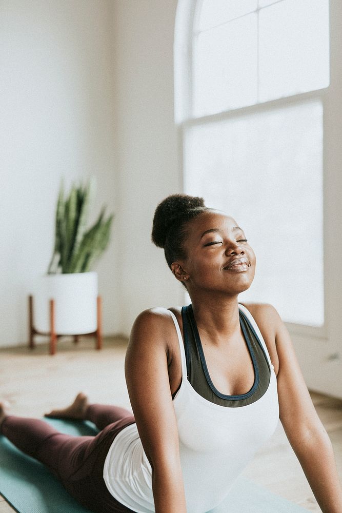 Black lady doing a Bhujangasana pose