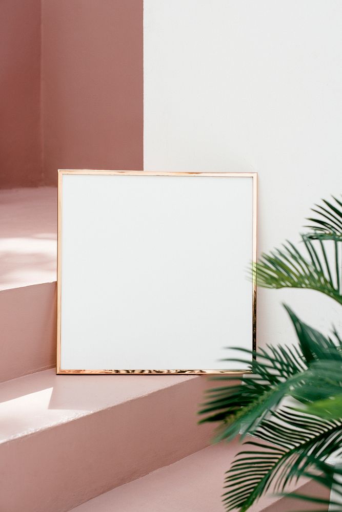 Golden shiny frame mockup on a pink stairway