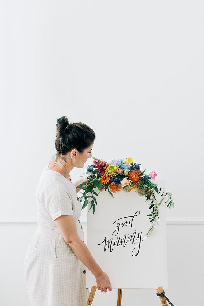 Woman with a floral greeting canvas frame