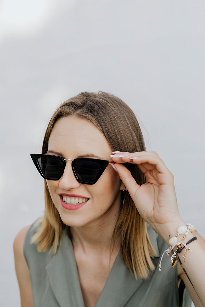 Happy woman in her sunglasses