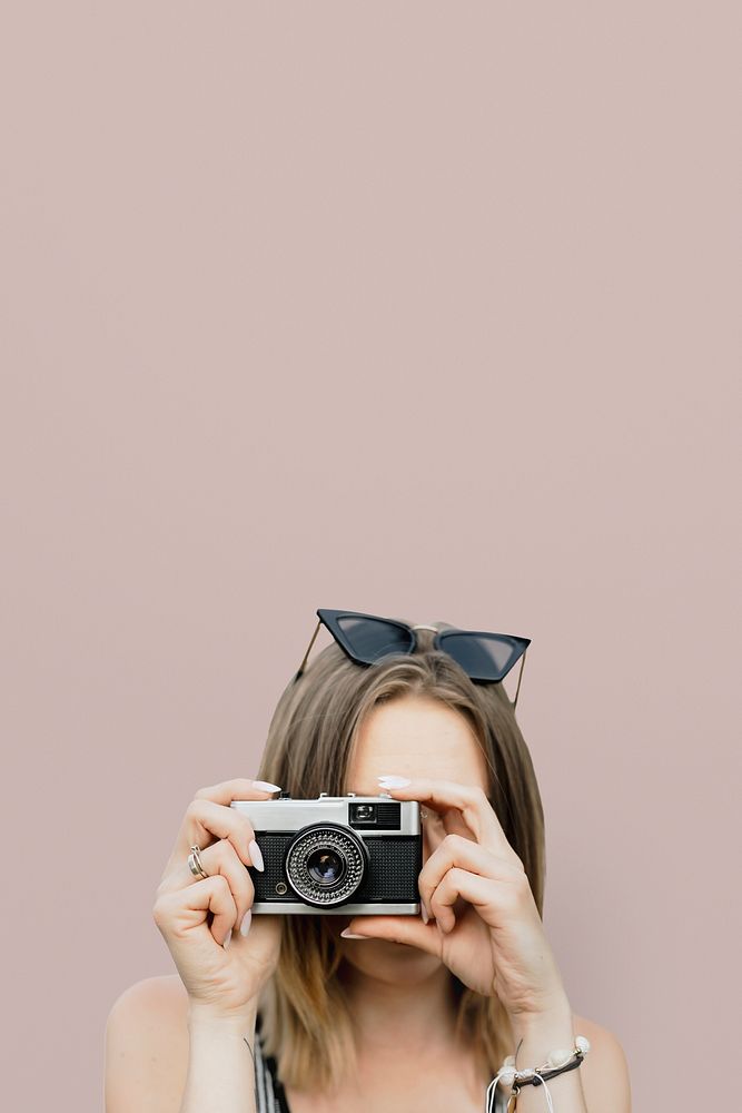 Woman using a compact camera