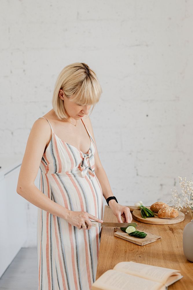 Pregnant woman cooking in a kitchen