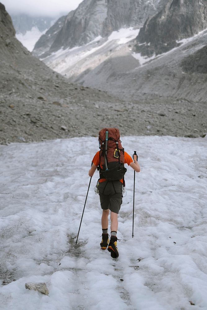 Hiker going up Chamonix Alps in France