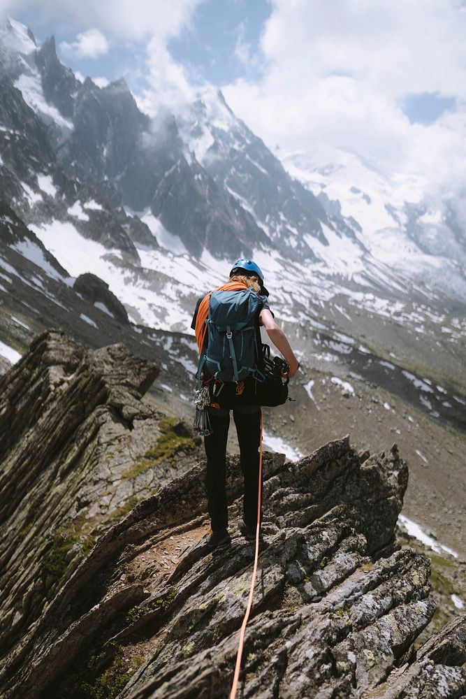 Backpacker hiking up the Chamonix Alps in France