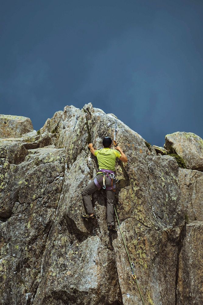 Rock climber working his way up  Chamonix Alps in France