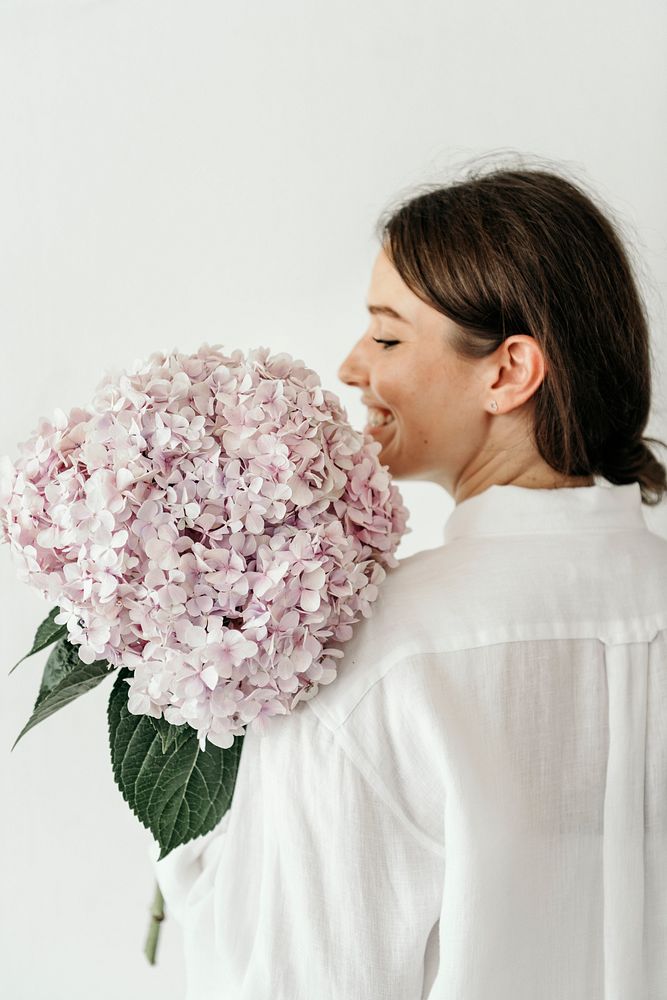 Woman holding a bouquet of hydrangea