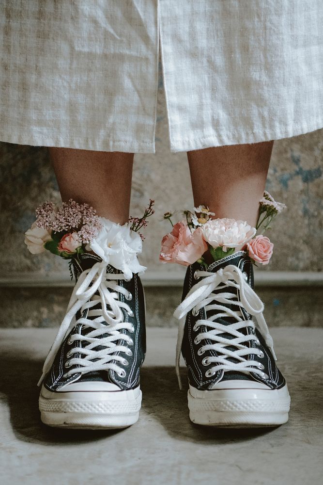Woman wearing shoes with flowers