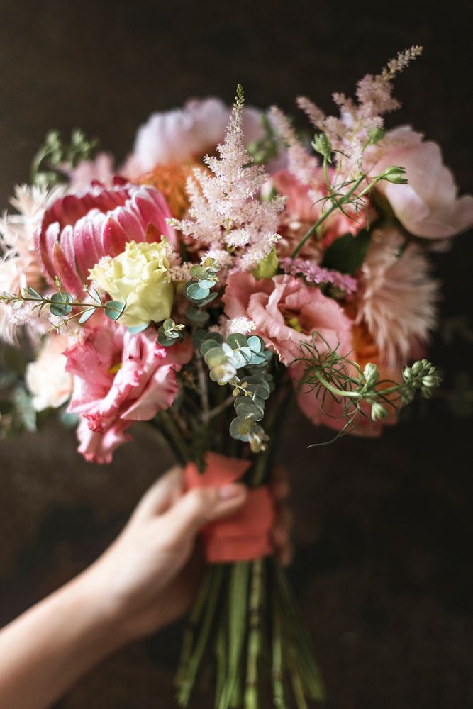 Woman holding a bouquet of flowers