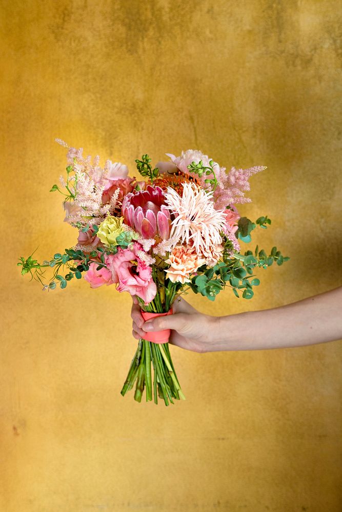 Woman holding a bouquet of flowers