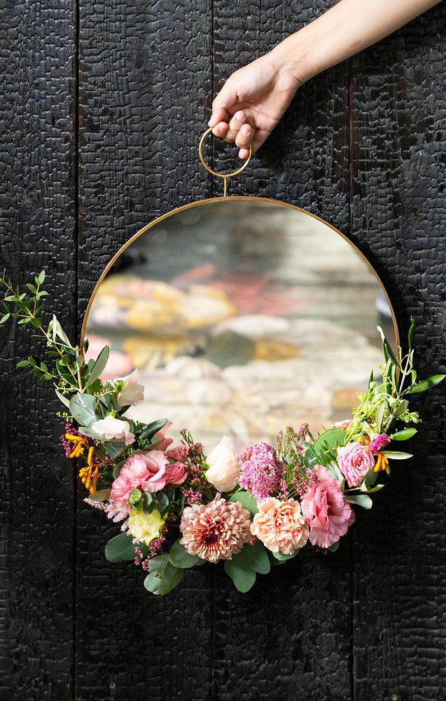 Cute round mirror decorated with flowers