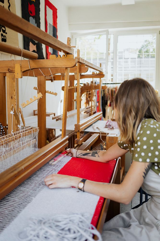 Woman weaving on a loom