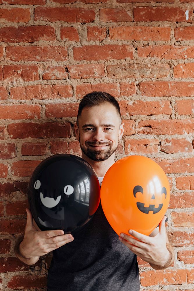 Man with cute Halloween balloons