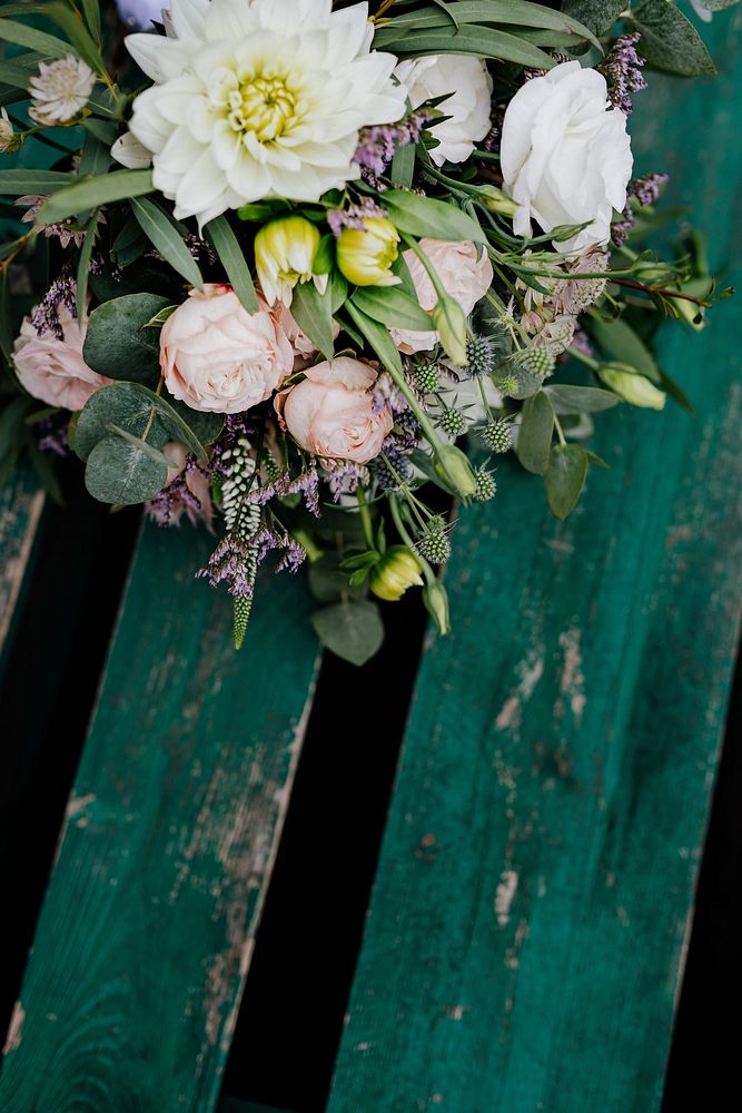 Bouquet of pastel flowers on a wooden table