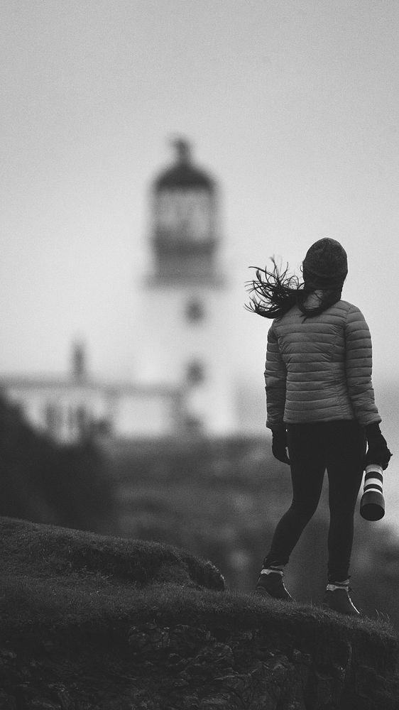 Female photographer at Neist Point Lighthouse, Isle of Skye, Scotland mobile phone wallpaper