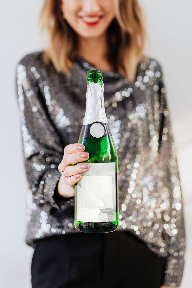 Woman holding a champagne bottle
