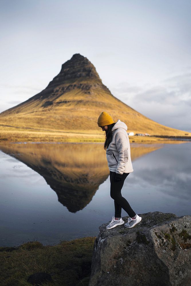 Female traveler at Kirkjufell mountain, Iceland