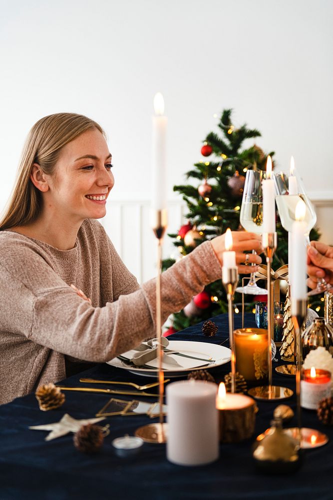 Blond woman having a romantic Christmas dinner