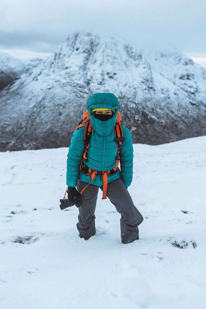 Female photographer climbing at Glen Coe, Scotland