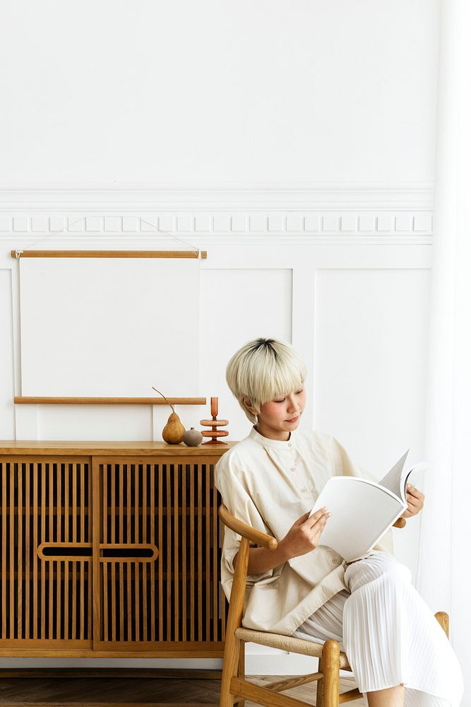 Woman sitting in her mid century modern living room