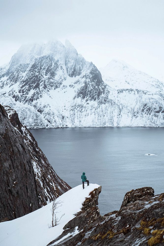 Man hiking up Segla mountain in Norway