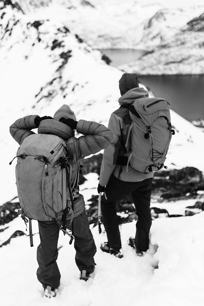 Backpackers hiking up Segla mountain, Norway