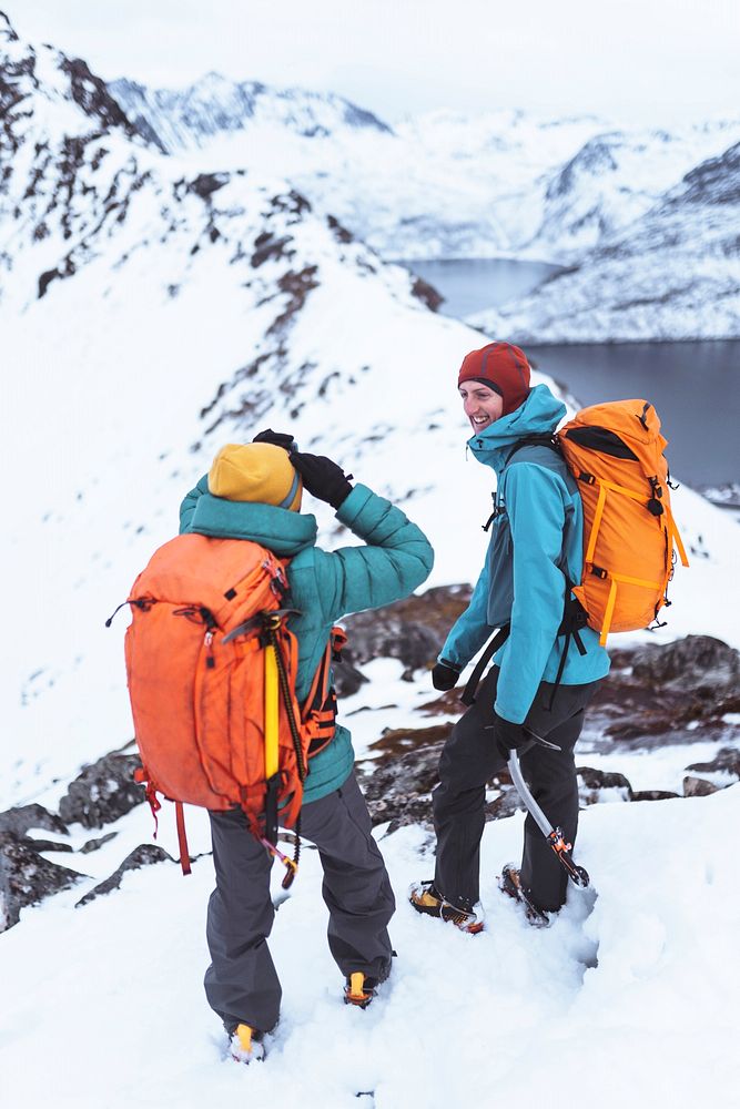 Backpackers hiking up the Segla mountain, Norway 