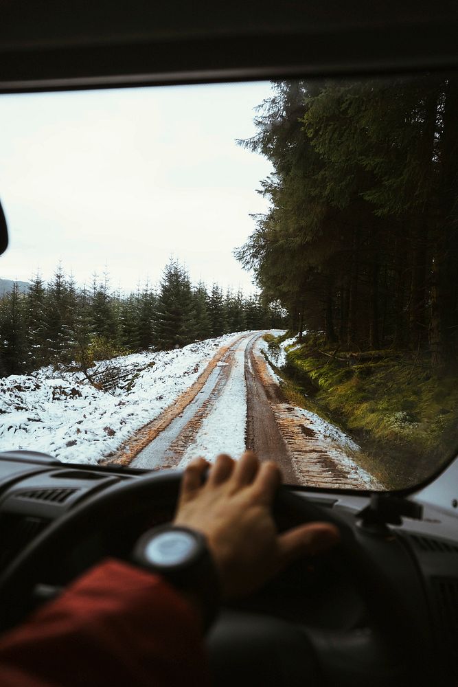 Man driving in the Trossachs, Scotland