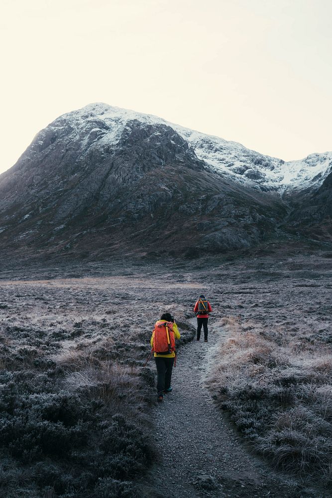 Hikers at Glen Coe valley in the Scottish Highlands