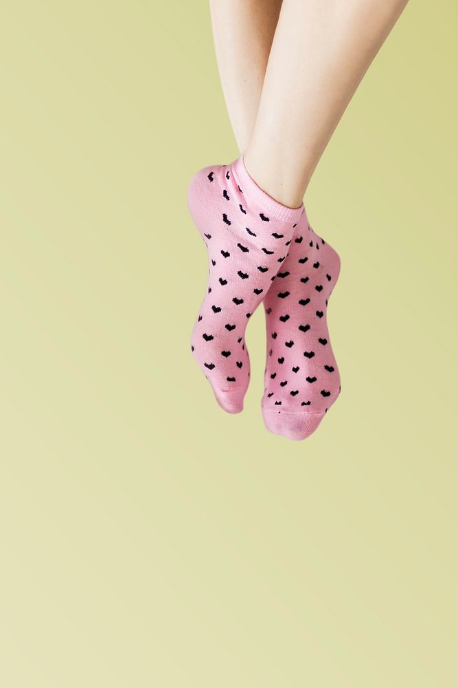 Woman in pink socks with her legs crossed 