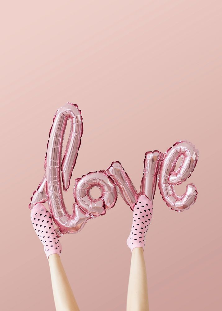 Love glossy pink foil balloon on pink background mockup