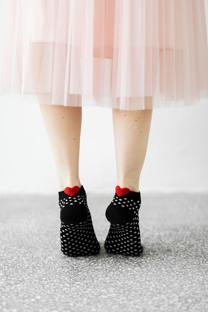 Woman in tip toes wearing black socks