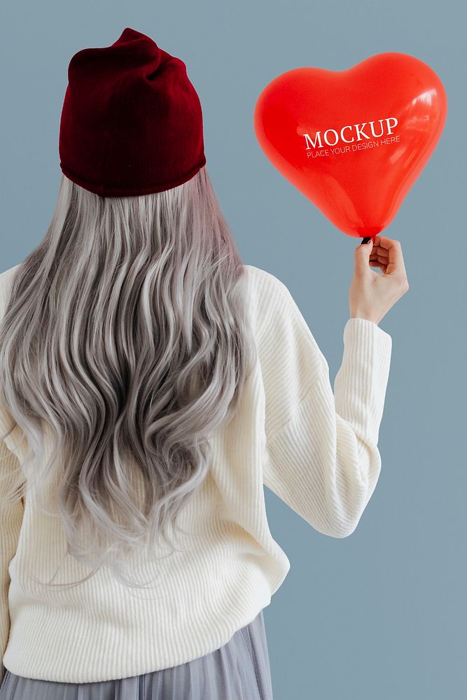 Woman showing a heart red balloon mockup