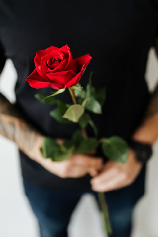 Tattooed man with a rose 