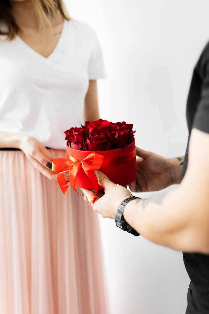 Boyfriend surprising his girlfriend with roses 