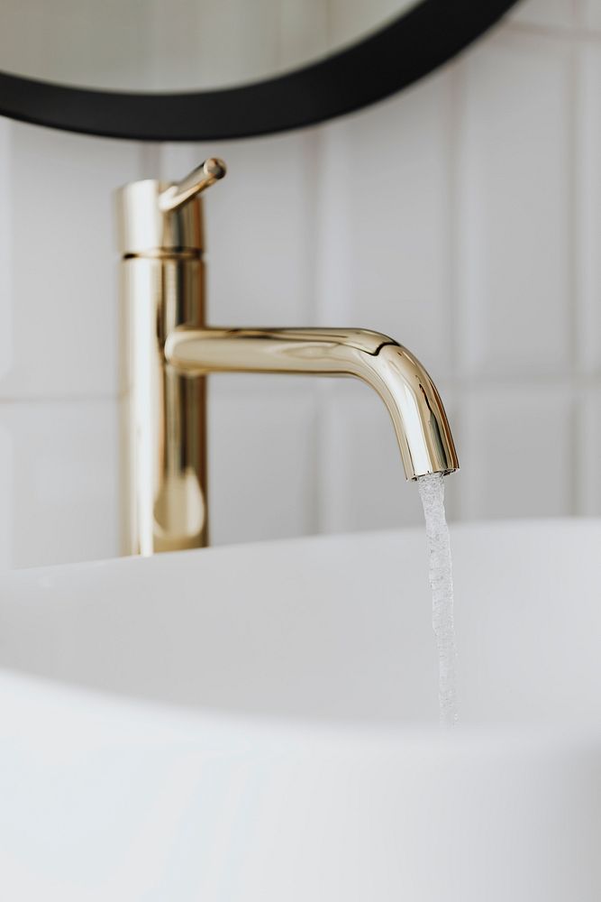 Golden faucet with running water 