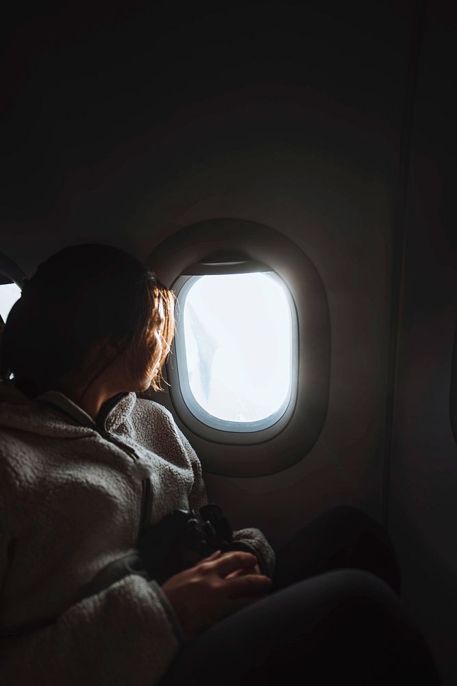 Traveler on a flight over the Atlantic ocean to the Faroe Islands